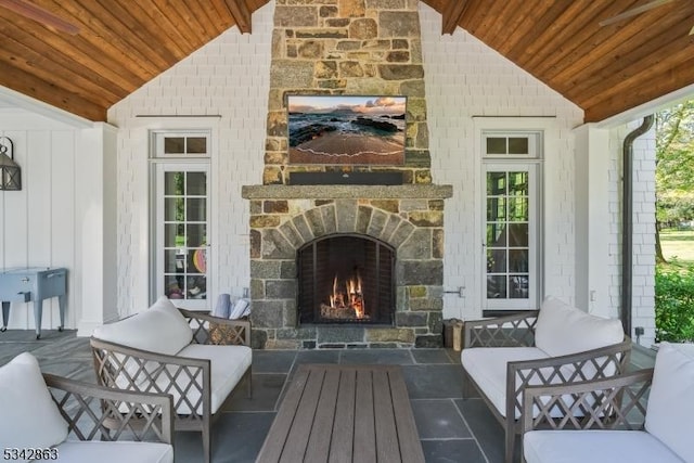 view of patio / terrace with an outdoor stone fireplace