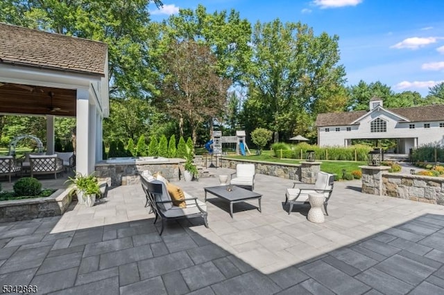 view of patio / terrace featuring an outdoor hangout area and a playground