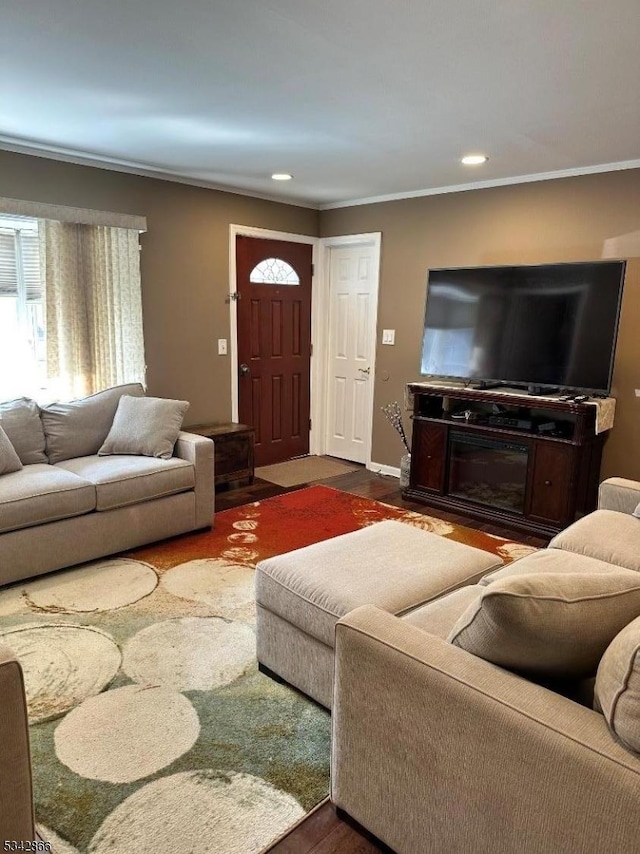 living area with recessed lighting, baseboards, and crown molding