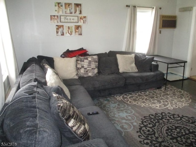 living room featuring an AC wall unit