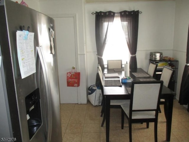 dining room featuring light tile patterned floors