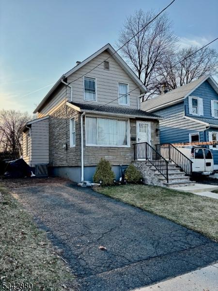 view of front of home with stone siding