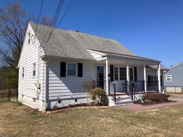 view of front of home featuring fence, covered porch, a shingled roof, a front lawn, and crawl space