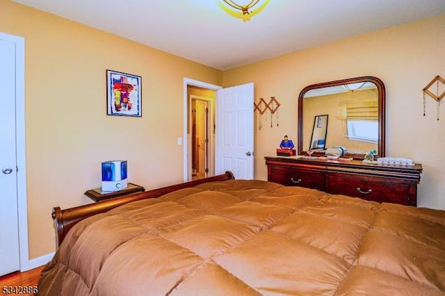 bedroom featuring wood finished floors