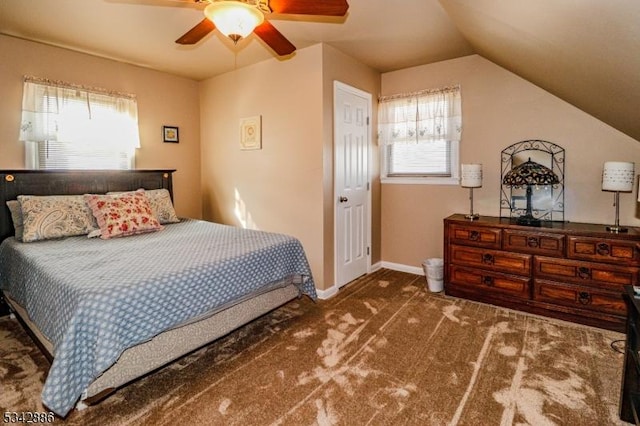 bedroom featuring multiple windows, baseboards, carpet, and vaulted ceiling