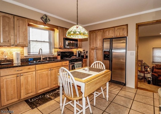 kitchen with backsplash, light tile patterned flooring, appliances with stainless steel finishes, and a sink