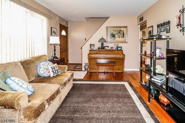 living room with baseboards and wood finished floors