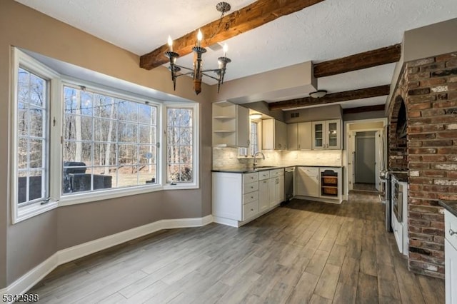 kitchen featuring open shelves, dark wood-style floors, baseboards, and backsplash