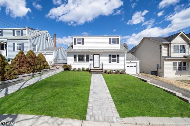 view of front of house featuring a garage and a front yard