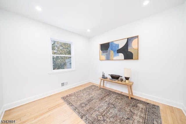 office space with visible vents, recessed lighting, baseboards, and wood finished floors