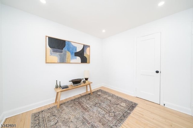 office featuring recessed lighting, wood finished floors, and baseboards