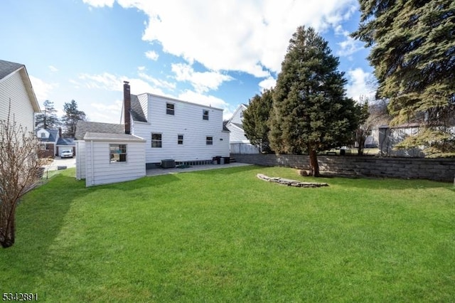 view of yard with a patio and fence