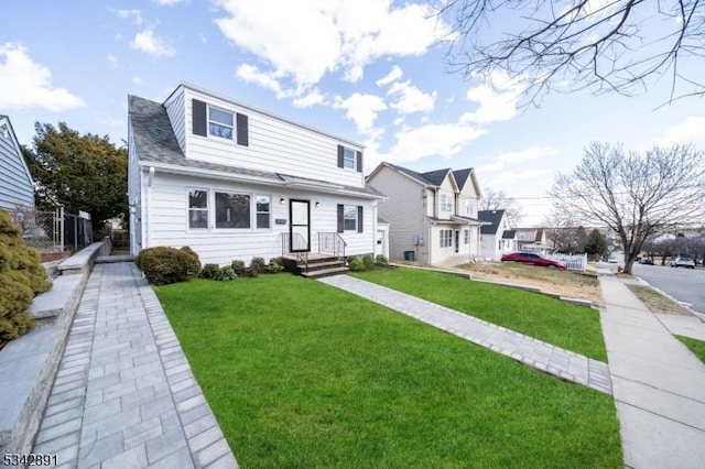 view of front of property with a front lawn