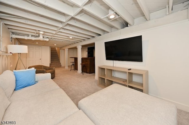 carpeted living room featuring stairs