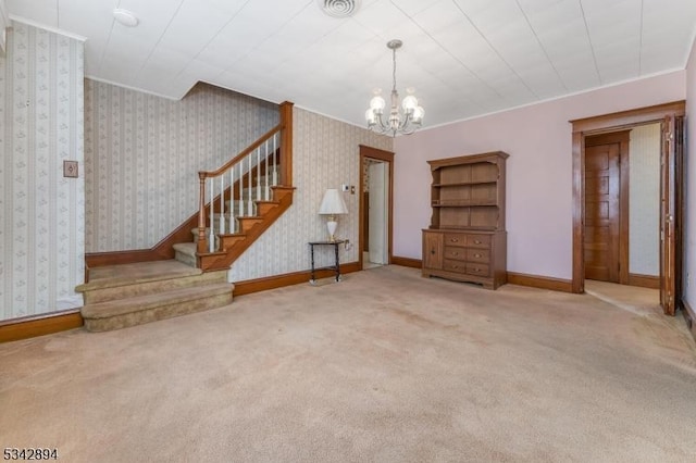 interior space with wallpapered walls, baseboards, a chandelier, stairway, and carpet flooring