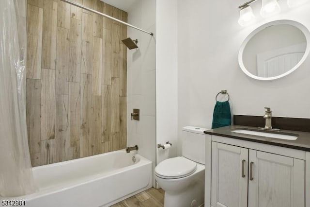 full bathroom featuring vanity, wood finished floors, toilet, and shower / bathtub combination with curtain