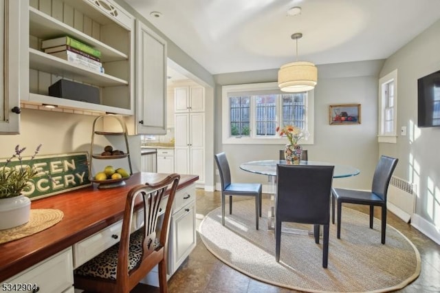 dining room featuring baseboards