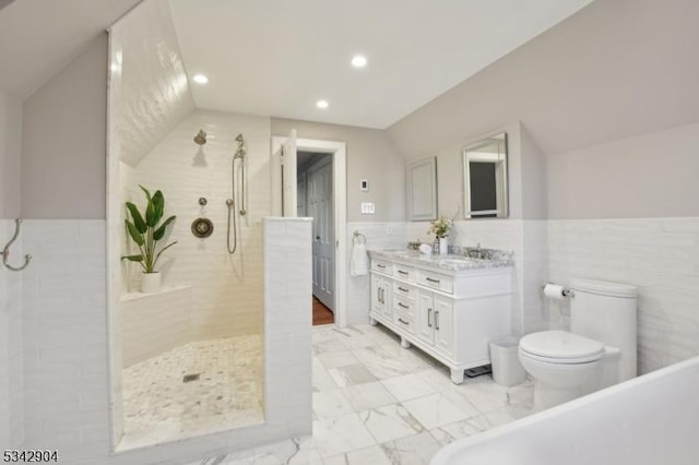 bathroom featuring double vanity, tiled shower, marble finish floor, and wainscoting