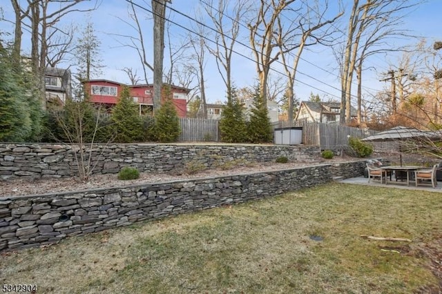 view of yard with fence and a patio area