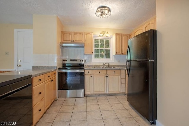 kitchen with electric range, light brown cabinetry, freestanding refrigerator, a sink, and under cabinet range hood