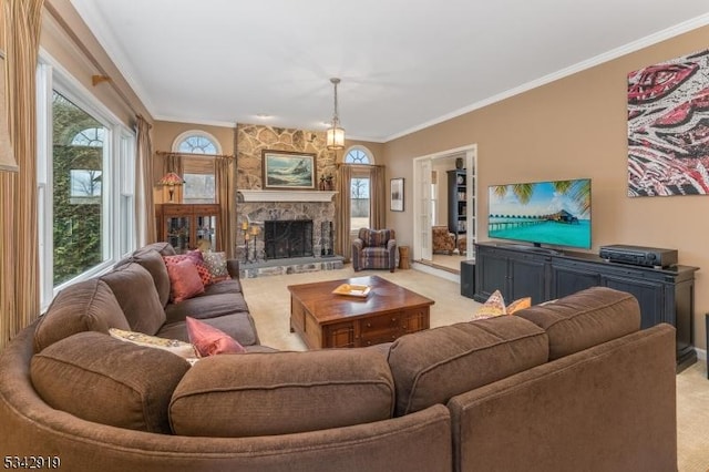 living area with a healthy amount of sunlight, a fireplace, light colored carpet, and ornamental molding