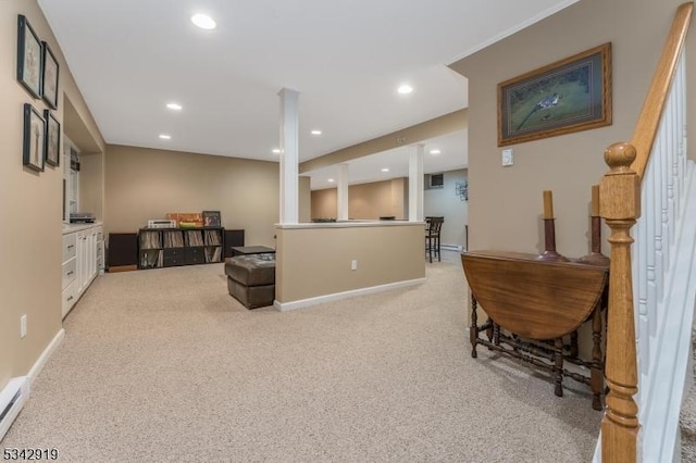 interior space featuring recessed lighting, baseboards, light carpet, and a baseboard heating unit