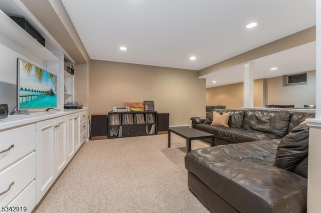 living room with light carpet and recessed lighting