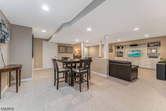 dining space with light carpet, recessed lighting, and baseboards