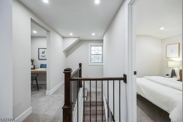 hallway featuring an upstairs landing, carpet flooring, recessed lighting, and baseboards