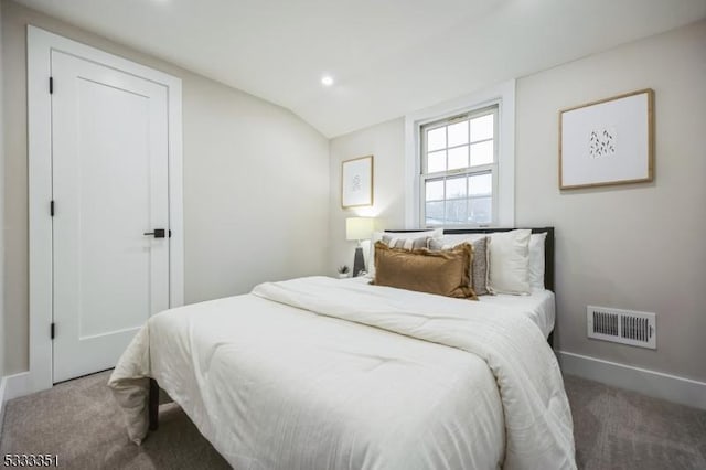 bedroom featuring visible vents, recessed lighting, carpet, baseboards, and vaulted ceiling