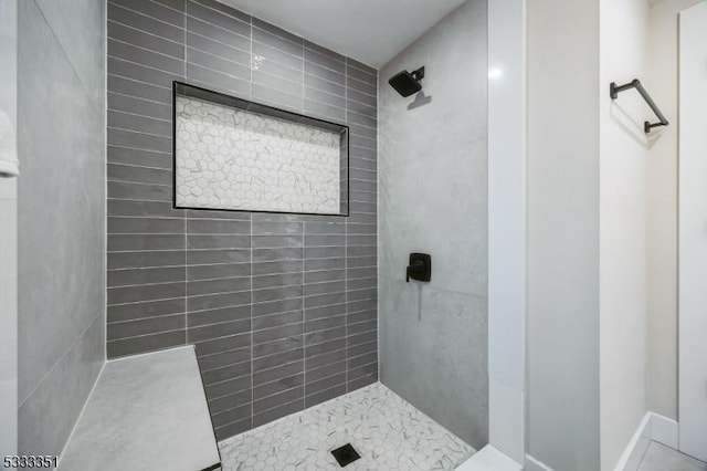 full bathroom with tiled shower