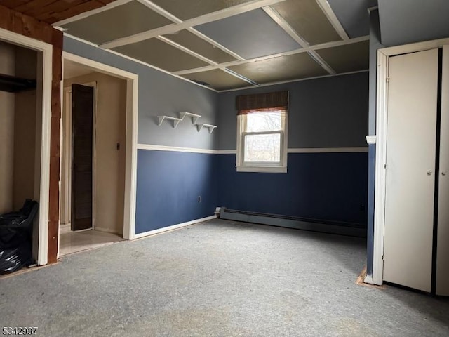 unfurnished bedroom with a baseboard radiator