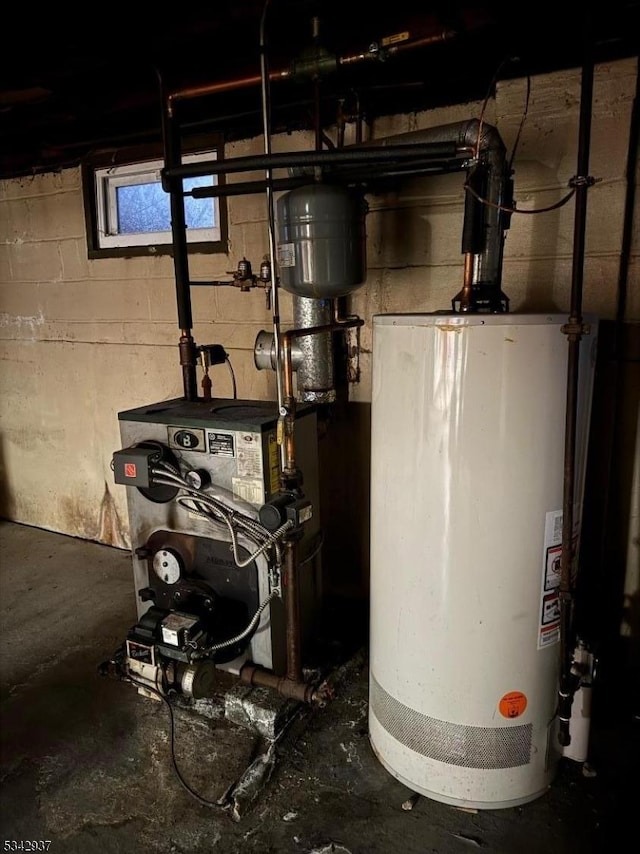 utility room with water heater and a heating unit