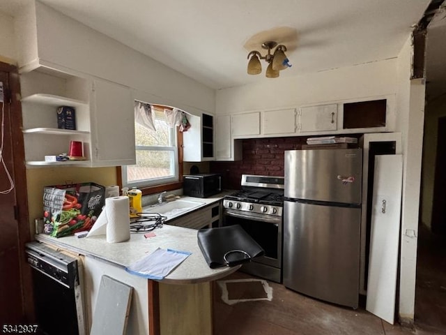 kitchen with black appliances, a sink, open shelves, white cabinetry, and a peninsula