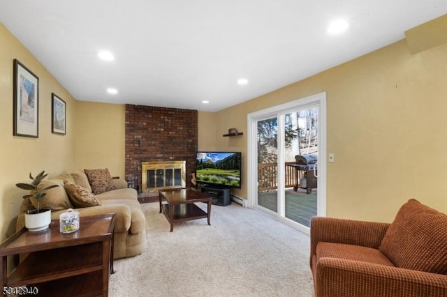 carpeted living room with recessed lighting and a fireplace