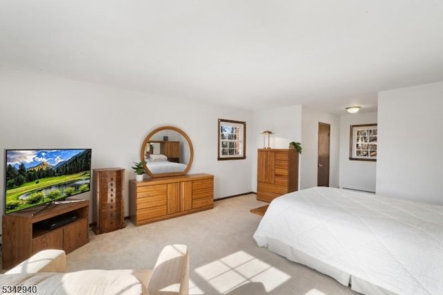 bedroom with light colored carpet