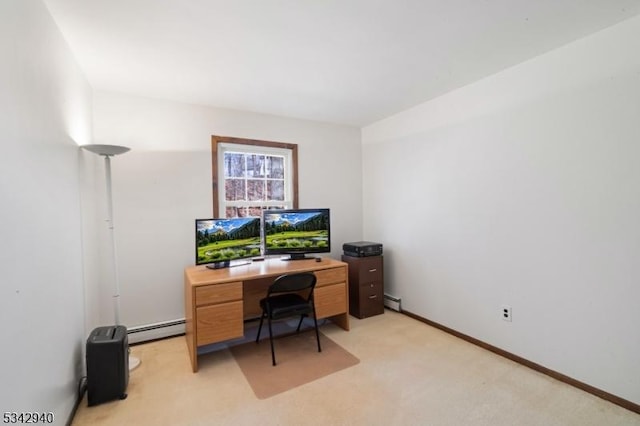 office space with a baseboard heating unit, baseboards, and light carpet