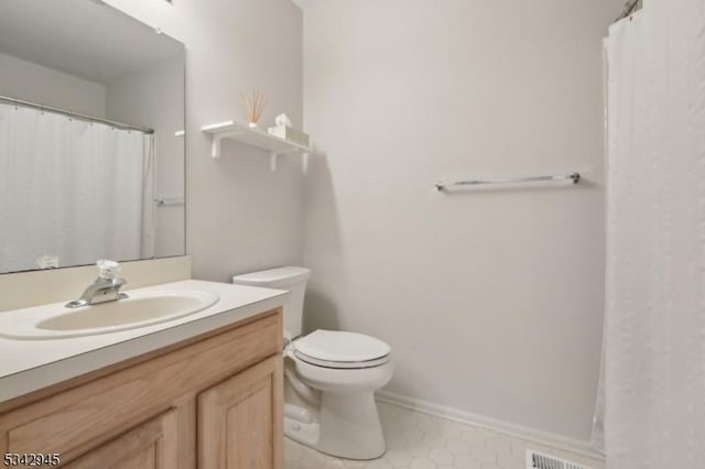 bathroom with vanity, toilet, visible vents, and tile patterned flooring