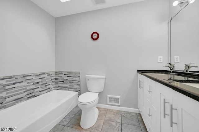 bathroom featuring tile patterned flooring, visible vents, toilet, a garden tub, and double vanity