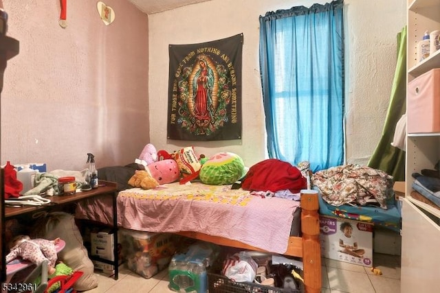 bedroom featuring tile patterned flooring