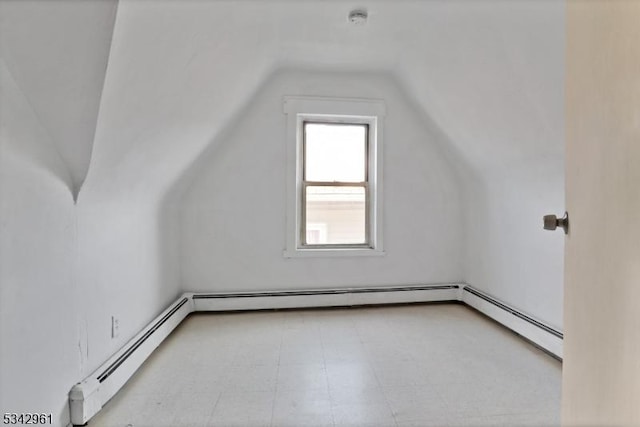 bonus room with lofted ceiling and a baseboard radiator