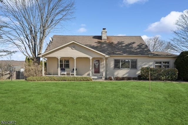 view of front of house featuring a chimney, roof with shingles, a porch, and a front lawn