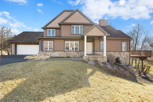 craftsman inspired home with stone siding, driveway, an attached garage, and a chimney