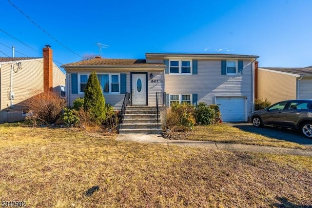 split level home featuring an attached garage