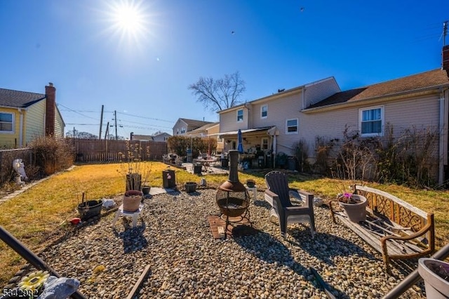 view of yard with a patio, an outdoor fire pit, and a fenced backyard