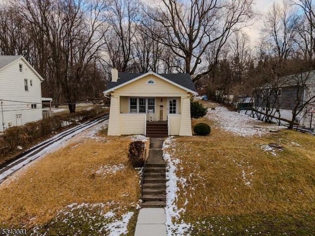 view of front of house featuring a chimney