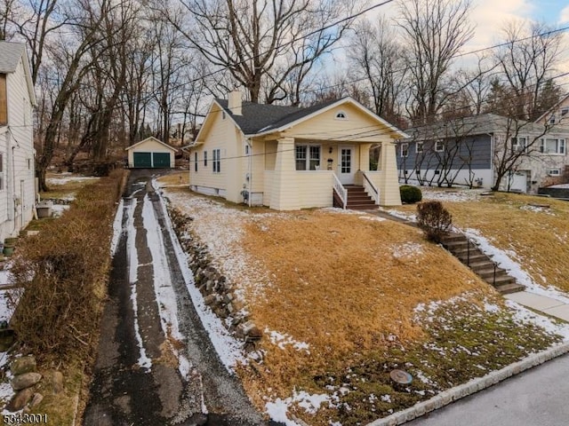 bungalow-style home with a chimney