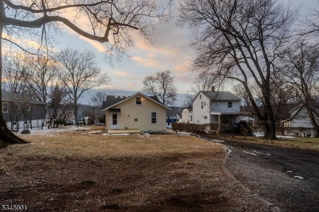 view of back of house at dusk