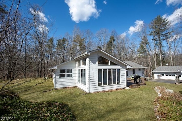 rear view of house with a lawn