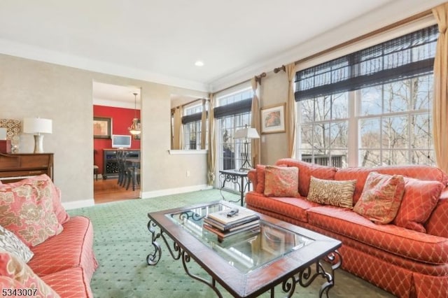 living area featuring carpet flooring, beverage cooler, baseboards, and ornamental molding